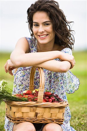 simsearch:877-06832290,k - Young woman with a basket full of fruits Stock Photo - Rights-Managed, Code: 877-06832269