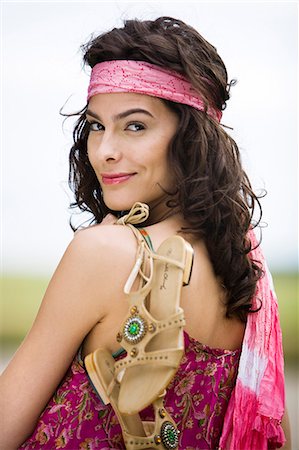 Young woman holding her sandals, oudoors Stock Photo - Rights-Managed, Code: 877-06832296