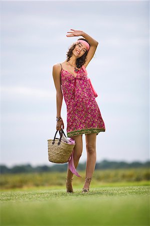 Young woman on grass, oudoors Stock Photo - Rights-Managed, Code: 877-06832304