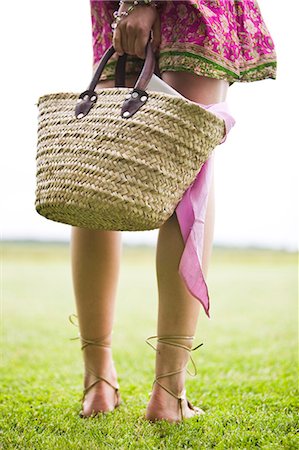 Young woman on grass, legs, oudoors Stock Photo - Rights-Managed, Code: 877-06832300