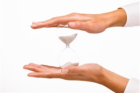 Woman's hands holding a hourglass Stock Photo - Rights-Managed, Code: 877-06832589