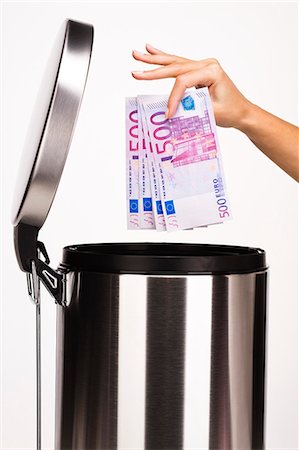 dustbin with waste material - Woman's hand throwin four 500 Euros notes in the garbage Stock Photo - Rights-Managed, Code: 877-06832617