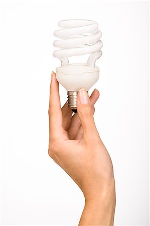 Woman's hand holding energy saving bulb Stock Photo - Rights-Managed, Code: 877-06832700