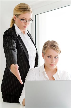 Businesswoman scolding another one Stock Photo - Rights-Managed, Code: 877-06832745