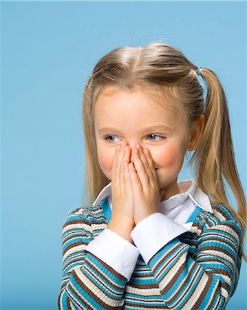 Little girl with hands covering mouth Stock Photo - Rights-Managed, Code: 877-06833360