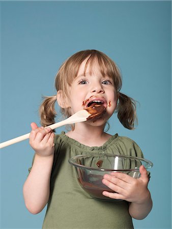 Little girl eating chocolate Stock Photo - Rights-Managed, Code: 877-06833398