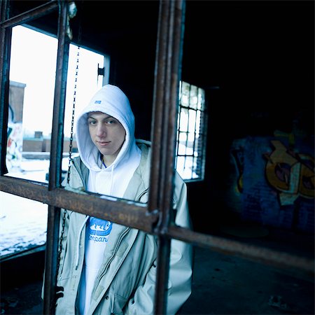 picture kid sad window - Teenage boy in disused plant Stock Photo - Rights-Managed, Code: 877-06833493