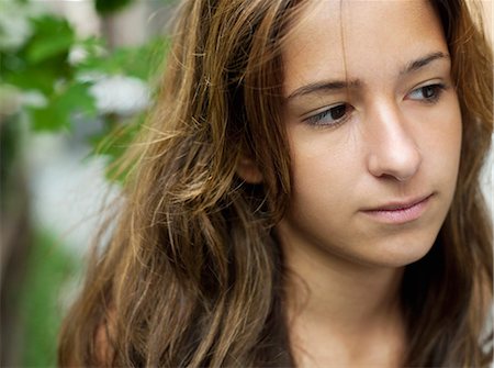 Portrait of teenage girl daydreaming Stock Photo - Rights-Managed, Code: 877-06833978