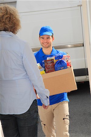 France, deliveryman at main door. Stock Photo - Rights-Managed, Code: 877-07460402