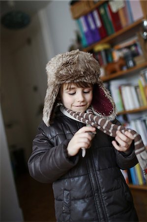 A 5 years old boy dressing before to go outside Stock Photo - Rights-Managed, Code: 877-08079180