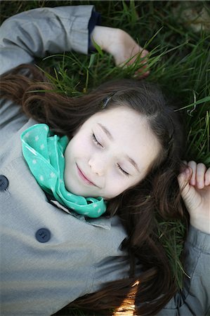 simsearch:877-06832318,k - Portrait of a 7 years old girl, she is lying in the grass Stock Photo - Rights-Managed, Code: 877-08079209