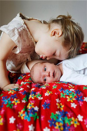 simsearch:640-06963757,k - A 3 years old girl kissing her newborn brother Stock Photo - Rights-Managed, Code: 877-08127972
