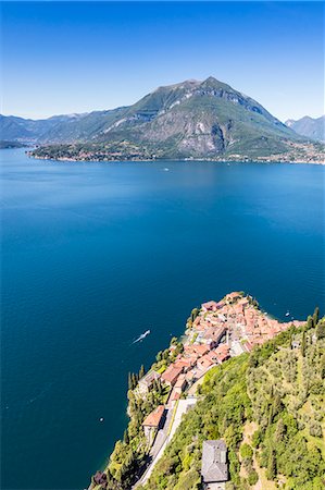 simsearch:400-05044143,k - Aerial view of Varenna frames by the blue water of Lake Como on a sunny spring day Lecco Province Lombardy Italy Europe Stock Photo - Rights-Managed, Code: 879-09034193