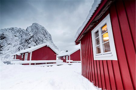 simsearch:693-03557828,k - Clouds on the typical red houses of fishermen called Rorbu surrounded by snowy Hamnøy Lofoten Islands Northern Norway Europe Foto de stock - Con derechos protegidos, Código: 879-09034200