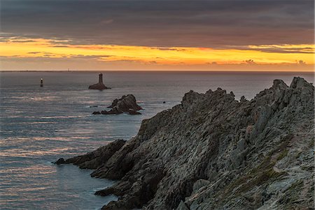 simsearch:632-05759883,k - Vieille lighthouse from Raz point at sunset. Plogoff, Finistère, Brittany, France. Stock Photo - Rights-Managed, Code: 879-09033295