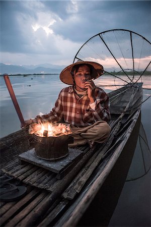 simsearch:400-05676936,k - Inle lake, Nyaungshwe township, Taunggyi district, Myanmar (Burma). Local fisherman before dawn with fireplace on the boat. Stock Photo - Rights-Managed, Code: 879-09033495
