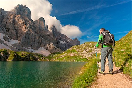 simsearch:400-05731177,k - Europe, Italy, Veneto, Belluno. Hiker passes near Lake Coldai along the CAI 560, which at this point coincides with the Alta Via n. 1 of the Dolomites. Stock Photo - Rights-Managed, Code: 879-09033569