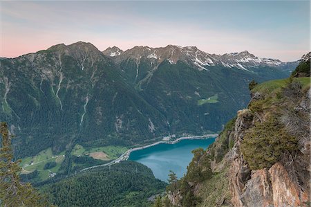 Overview of rocky peaks and lake at dawn, San Romerio Alp, Brusio, Canton of Graubünden, Poschiavo valley, Switzerland Stock Photo - Rights-Managed, Code: 879-09100851