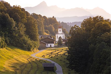The iconic Wamberg Church, with Mount Alpspitze and Zugspitze on the background. Wamberg, Garmisch Partenkirchen, Bayern, Germany Stock Photo - Rights-Managed, Code: 879-09100977