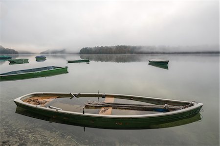 Boats on Sylvenstein Lake in the morning. Bad Tölz-Wolfratshausen district, Bavaria, Germany. Stock Photo - Rights-Managed, Code: 879-09128962