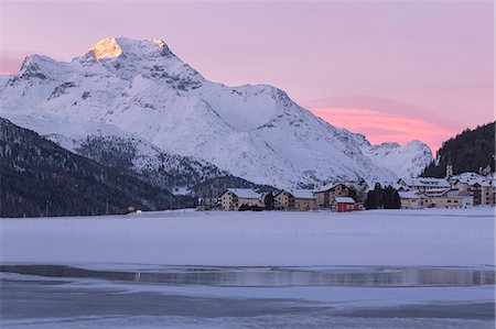 Village of Silvaplana and Piz Da La Margna seen from icy Lake Champfer, canton of Graubunden, Engadin, Switzerland Stock Photo - Rights-Managed, Code: 879-09129268