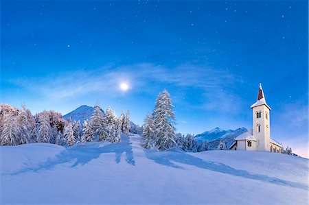 Moonlight on Chiesa Bianca surrounded by snow, Maloja, Bregaglia Valley, Canton of Graubunden, Engadin, Switzerland Stock Photo - Rights-Managed, Code: 879-09129260