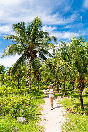 Woman exploring the Union Estate Plantation on La Digue island. La Digue, Seychelles, Africa Stock Photo - Rights-Managed, Code: 879-09189118