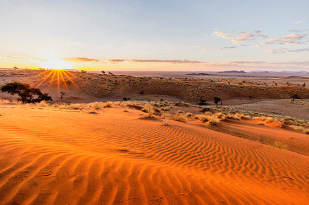 Sunset over the rippling red dunes of the world's oldest desert,Namib Naukluft National Park,Namibia,Africa Stock Photo - Rights-Managed, Code: 879-09189784