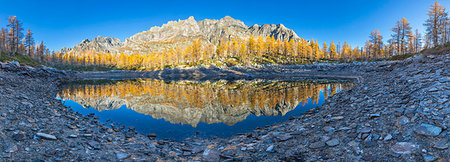 pennine alps - A panoramic view of the Nero Lake in autumn immediately after the sunrise (Buscagna Valley, Alpe Devero, Alpe Veglia and Alpe Devero Natural Park, Baceno, Verbano Cusio Ossola province, Piedmont, Italy, Europe) Stock Photo - Rights-Managed, Code: 879-09190354