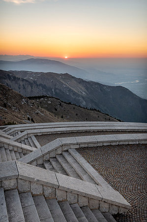 Monte Grappa, province of Treviso, Veneto, Italy, Europe. Sunrise over the Venetian plain, seen from the stairs at the military memorial monument Stock Photo - Rights-Managed, Code: 879-09190670