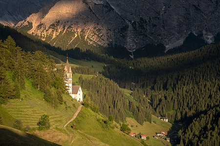 La Valle / Wengen, Alta Badia, Bolzano province, South Tyrol, Italy. The St. Barbara chapel at sunset Stock Photo - Rights-Managed, Code: 879-09190731
