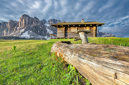 dolomiti - Passo Gardena, Dolomites, South Tyrol, Italy. Mountain hut in front of the mountains of the Sella group Stock Photo - Rights-Managed, Code: 879-09190732