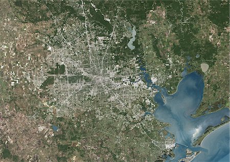 Houston, Texas, Usa, True Colour Satellite Image. Houston, Texas, USA. True colour satellite image of the city of Houston. Composite of 2 images taken on 6 October 1999 & 25 April 2001, using LANDSAT 7 data. Stock Photo - Rights-Managed, Code: 872-06052886