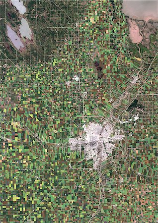 environment canada - Agriculture, Manitoba State, Canada, True Colour Satellite Image. True colour satellite image of cultivated fields in Manitoba State Around the Red River (in pink) and the mining city of Winnipeg (in grey). Image taken on 31 August 1991 using LANDSAT data. Stock Photo - Rights-Managed, Code: 872-06052957