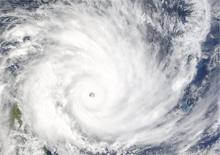 severe - Cyclone Gafilo, Indian Ocean, In 2004, True Colour Satellite Image. Tropical Cyclone Gafilo over the Indian Ocean, Northwest of Madagascar, on 6 March 2004. True-colour satellite image using MODIS data. Stock Photo - Rights-Managed, Code: 872-06053821