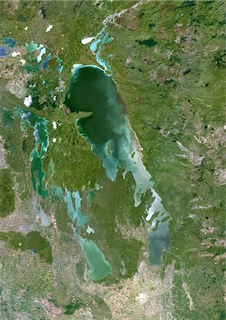 Lake Winnipeg, Canada, True Colour Satellite Image. True colour satellite image of Lake Winnipeg, in the province of Manitoba, Canada. The city of Winnipeg is at the bottom of the image. Composite image using LANDSAT 5 data. Stock Photo - Rights-Managed, Code: 872-06053892