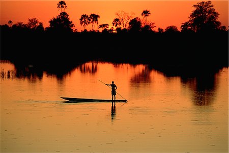simsearch:873-06440549,k - Batelier sur la rivière Chobe au coucher du soleil, Botswana Photographie de stock - Rights-Managed, Code: 873-06440245