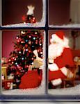 Santa Claus by Christmas Tree