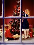 Children by Christmas Tree