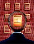 Man in Front of Brick Wall with Open Window on Back of Head