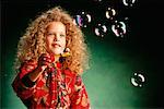 Little Girl Blowing Bubbles