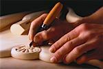 Close-Up of Hands Carving Wood