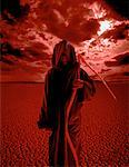 Portrait of Grim Reaper Standing In Desert with Scythe