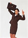 Portrait of Happy Businesswoman Holding Briefcase