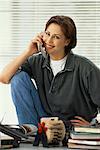 Portrait of Woman Using Cordless Phone, Smiling