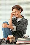 Woman in Home Office Using Cordless Phone