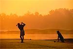 Silhouette of Man Golfing at Dusk Toronto, Ontario, Canada