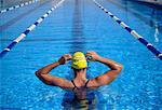 Back View of Female Swimmer Standing in Swimming Pool