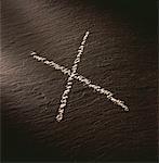 Chalk "X" Mark on Slate