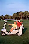 Mature Couple in Golf Cart, Deer Creek Golf Club, Deerfield Beach Florida, USA